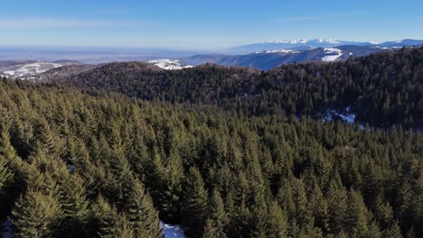 a panoramic view of the carpathian mountains in the background as seen from a mountain peak.