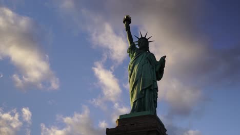 the statue of liberty over the scene of new york cityscape river side lower manhattan