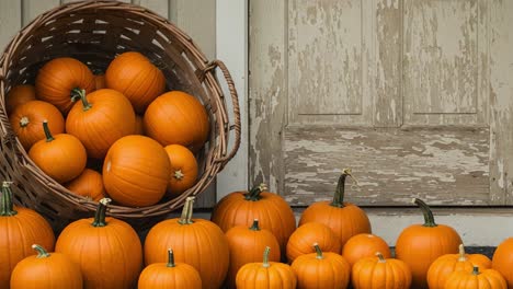 autumn pumpkin display with rustic basket and door