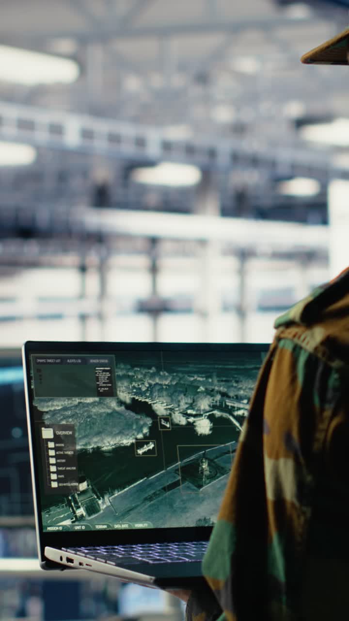 Vertical Video Military Engineer In Data Center Tracking Satellite Coordinates Using Laptop