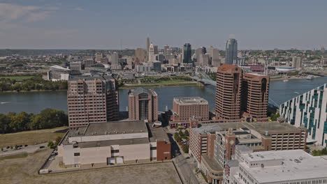 cincinnati ohio aerial v18 drone flyover covington's downtown area, soaring across the river, captures waterfront views of paycor stadium and city's skyline - shot with inspire 3 8k - september 2023