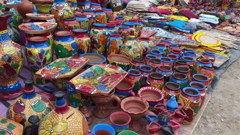 varieties of colorful decorative beautiful clay vases being sold at a roadside stall in kolkata, india