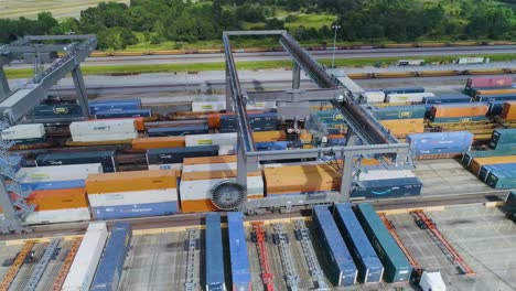 4K-Drone-Video-of-Trains-and-Trucks-at-CSX-Intermodal-Train-Yard-in-Winter-Haven,-FL