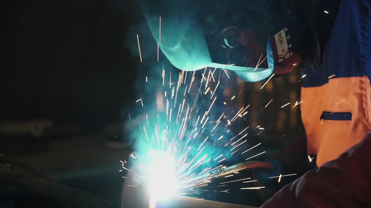 Welder Working on Pipe