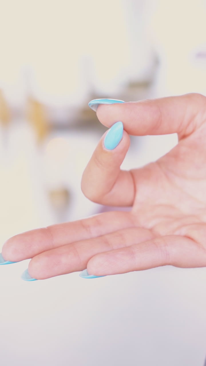 woman practices gyan mudra position meditating and relaxing in anti-gravity yoga hammock extreme close view