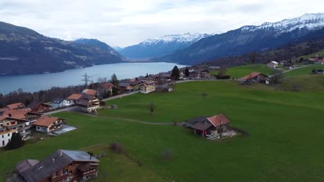 Switzerland-Grindelwald-cottage-view-in-winter-4K-drone-shot