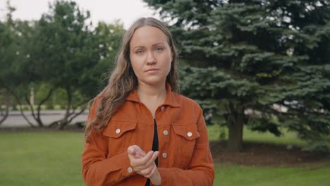 Young-caucasian-woman-claps-sarcastically-in-her-hands,-rude