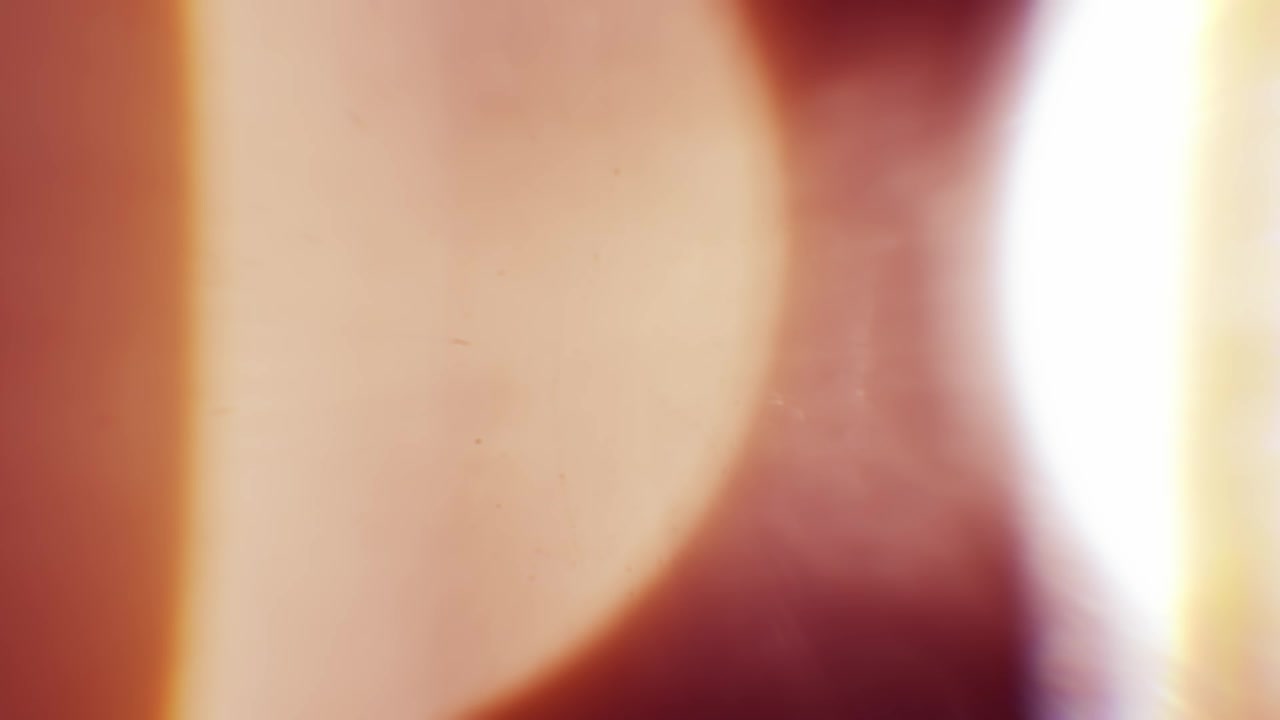 Vibrant Anamorphic Light Leaks on a Black Background