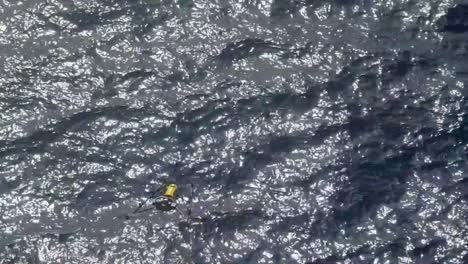 Drone-inspecting-an-offshore-oil-rig-at-sea