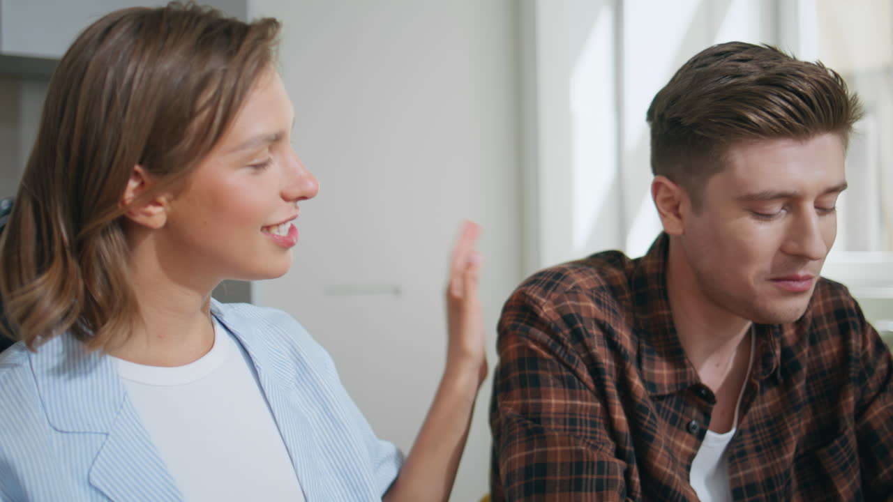 Closeup happy family breakfast together on weekend. Loving girl giving cereal