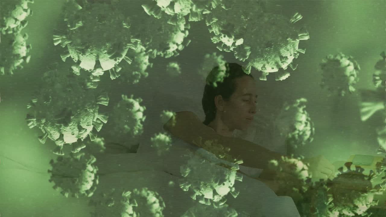 침대에 누워있는 백인 여성 위에 바이러스 세포의 애니메이션