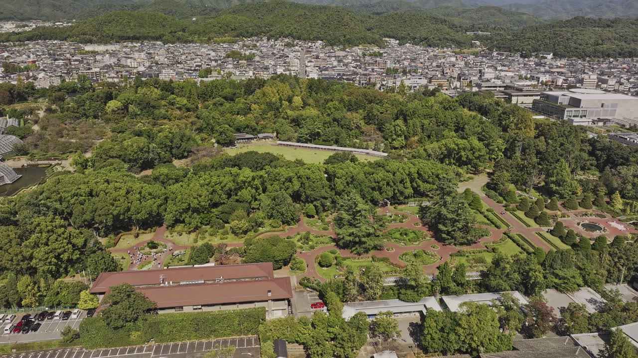 Kyoto Japan Aerial v60 birds eye view flyover Shimogamo Hangicho capturing botanical gardens in Sakyo ward, residential neighborhood and mountainous views - Shot with Mavic 3 Pro Cine - Oct 8th 2023