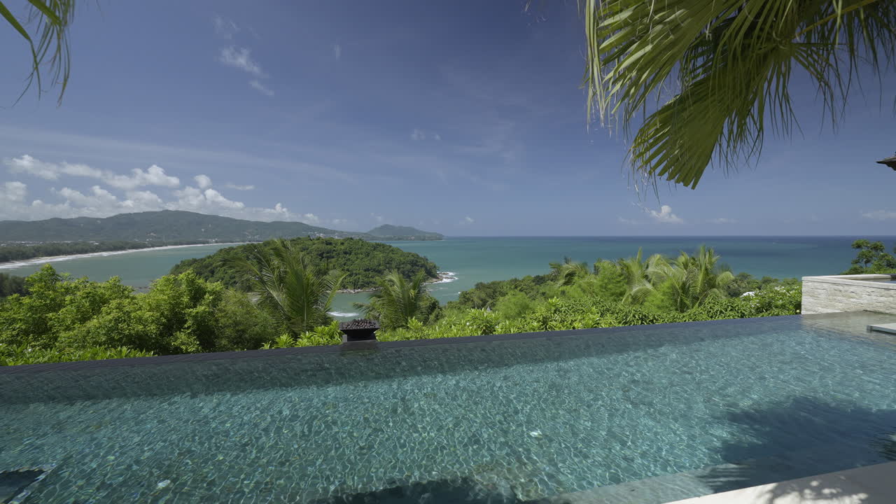 Stunning Swimming Pool with Sea and Mountain View at Luxury Resort in Phuket, Thailand. 4K Gimbal Shot