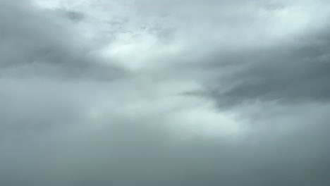 breathtaking view shot from a jet cabin gliding amongst the clouds