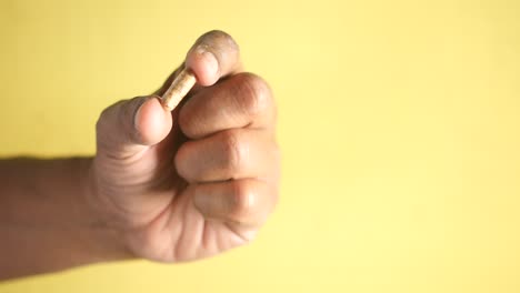 hand holding a capsule