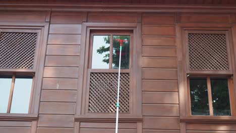 wooden building window cleaning