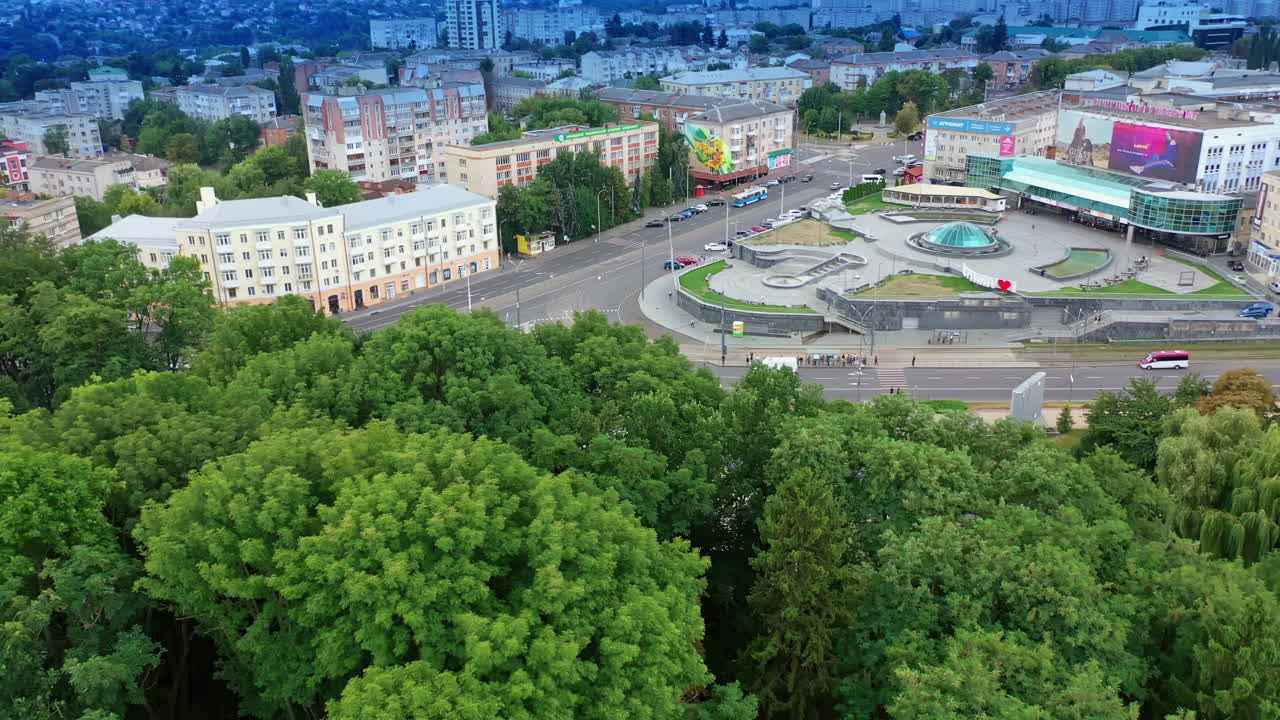 Fork in the road in the downtown. Urban architecture combined with lush greenery. Aerial view.