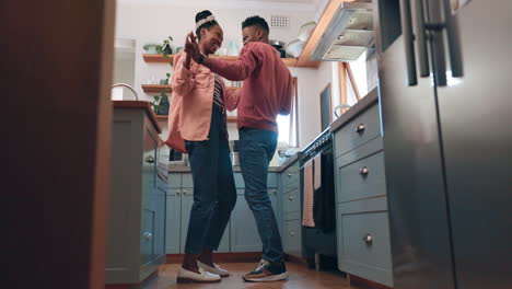 dance, happy and couple in kitchen for love