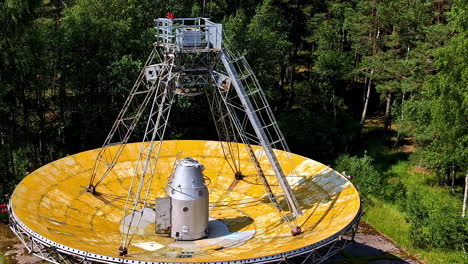 closeup shot of abandoned disc of rt-32 telescope kept on ground in irbene, latva.