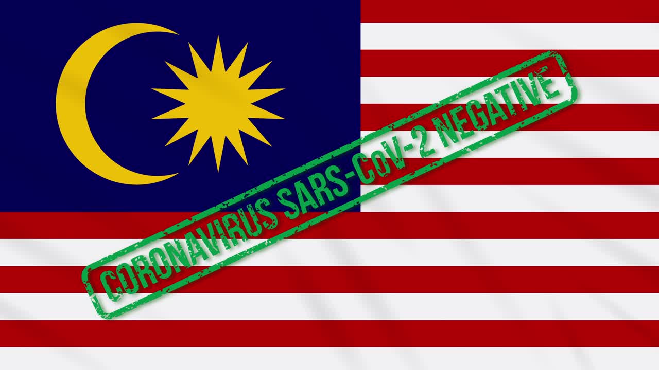 Bandiera della Malesia che sventola con timbro verde di libertà dal coronavirus, loop