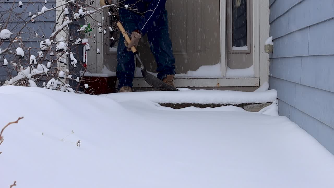 Loads of snow on the front porch need to be cleared in order to prevent slipping
