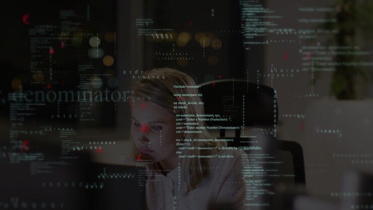 Female developer leaning toward glowing monitor in night office, analyzing code with overlays