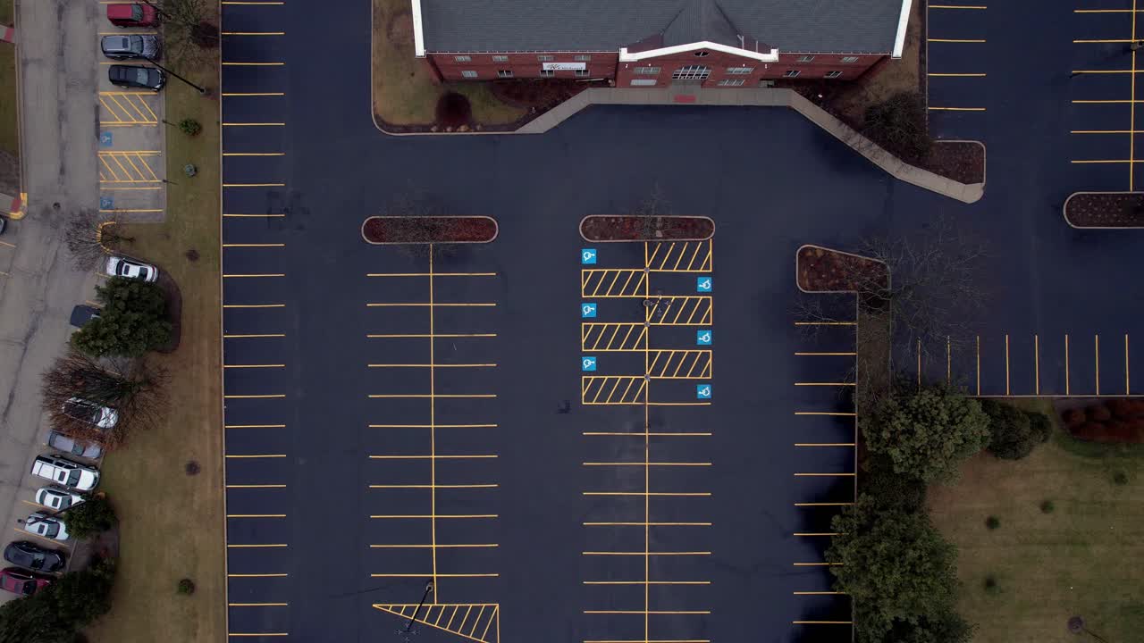 top down aerial of the orchard vernon hills evangelical parking lot, handicap parking spot visible