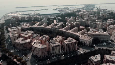 Top-View-Of-Cityscape-By-The-Port-Of-Genoa-City,-Italy-In-Liguria-Region-During-Hazy-Morning