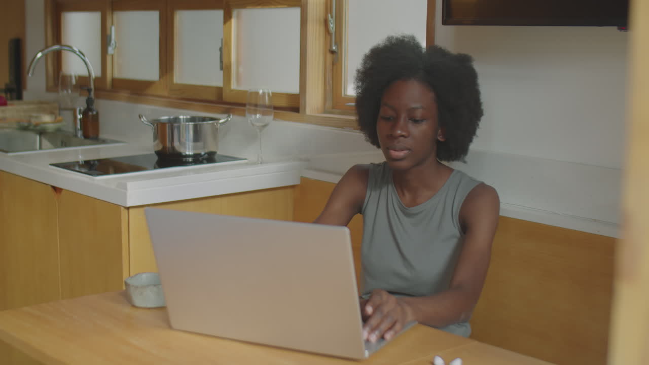 African American Woman Working on Laptop at Home