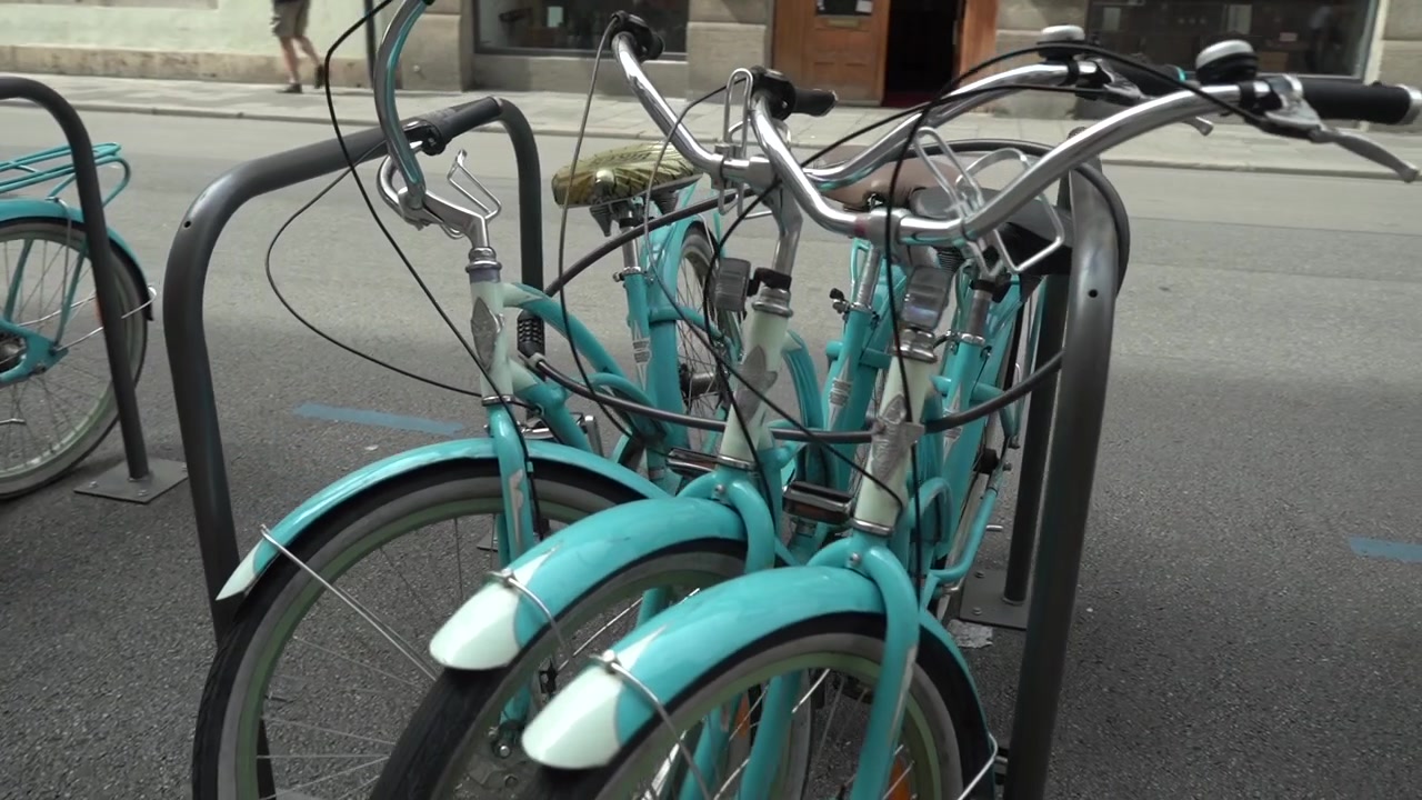 Blue bikes in munich germany downtown slow motion gimbal footage
