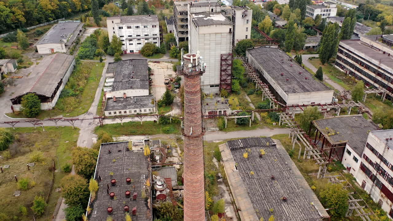 Damaged industry city buildings. Drone view of old ruined factory.