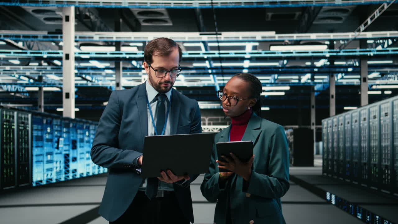 IT Professionals Discussing Data Management in a Modern Server Room
