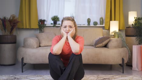 woman looking depressed at camera.