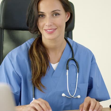 beautiful female doctor at laptop computer