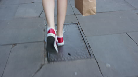 caucasian woman shopping in city walking in urban street