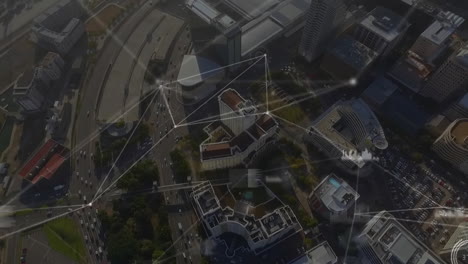 geometric shapes and lines animation over aerial view of cityscape