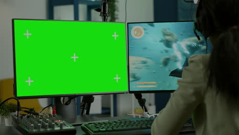 black woman gamer streaming with chroma key display