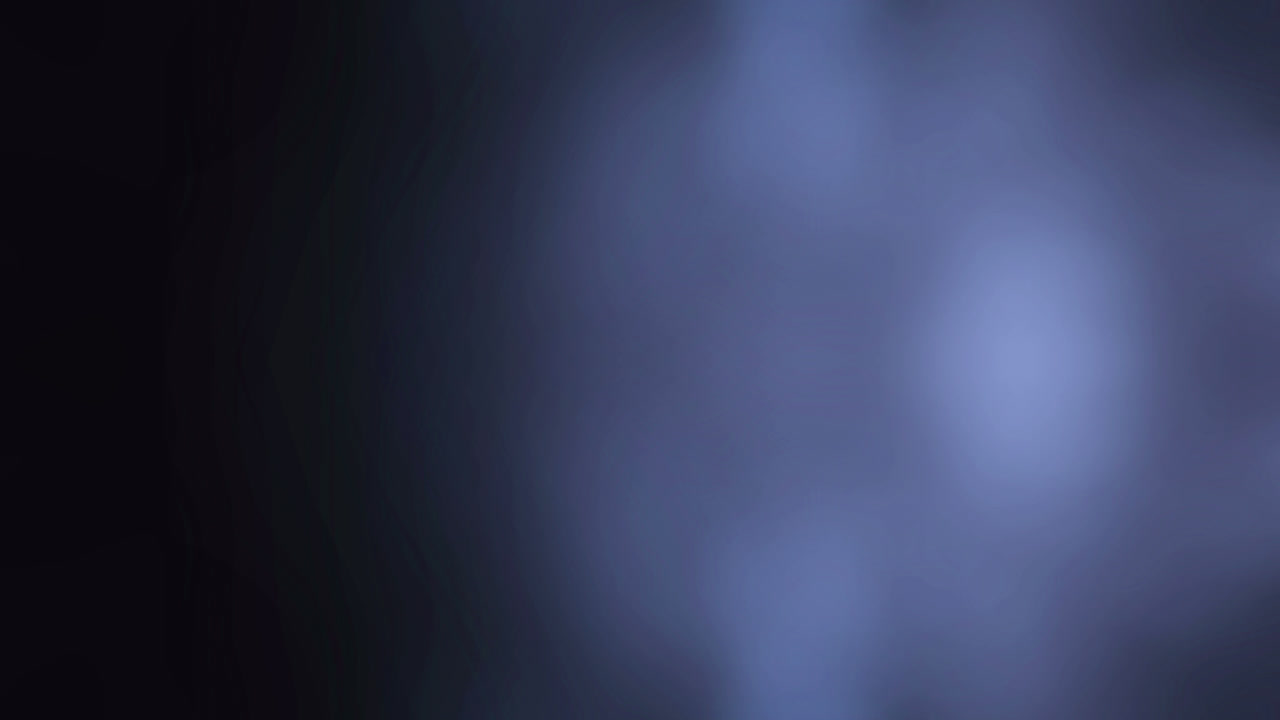 Flashing purple light on black background