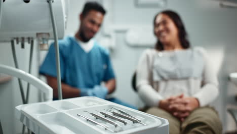 a dentist talks with a patient about their teeth