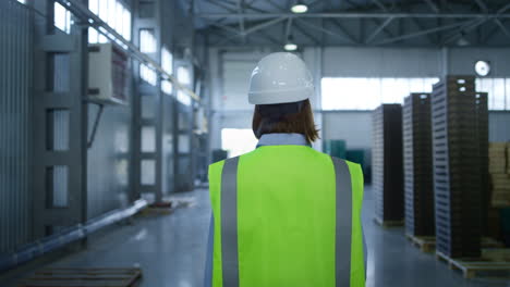 worker checking factory warehouse inspecting shipment process analysing delivery