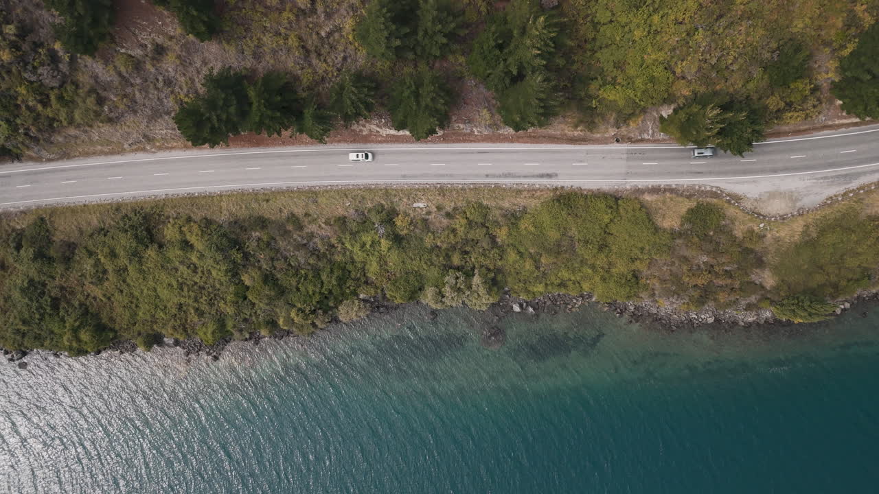 Aerial View of a Scenic Highway by a Lake