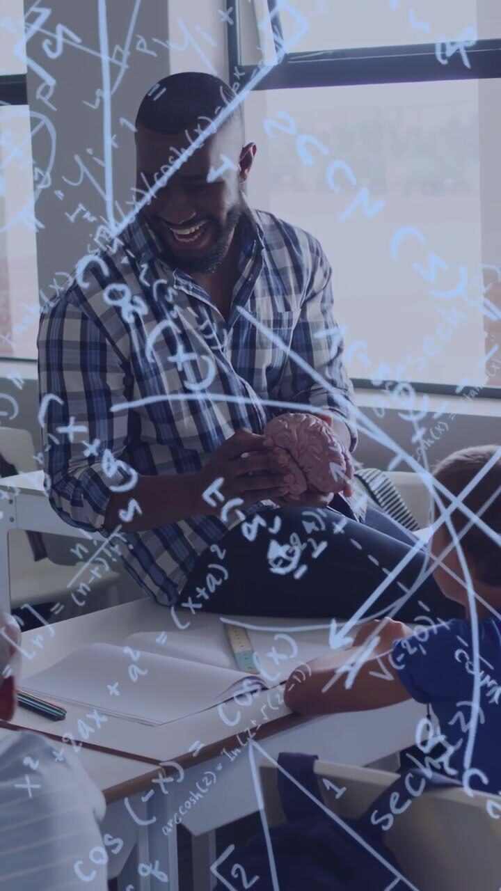 Vertical video: Teacher showing brain model, pupils leaning writing while math overlay aiding study