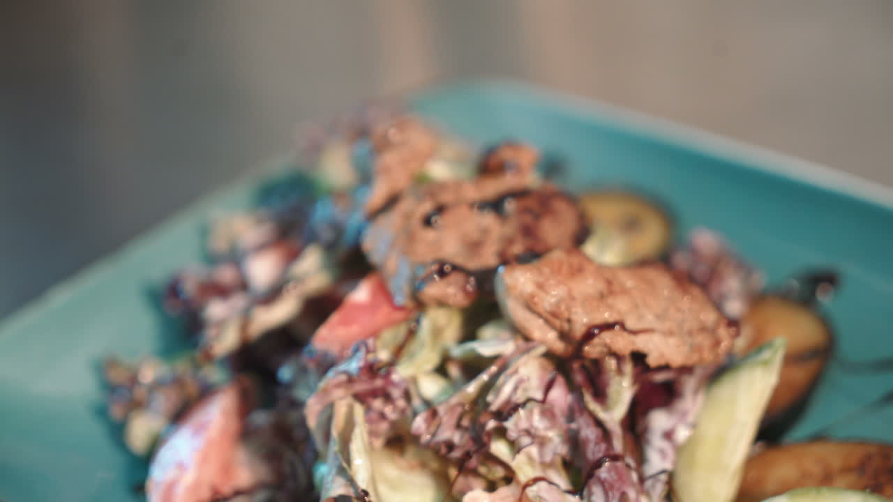 Chef decorating salad food. Close up of chef cooking food in restauran kitchen