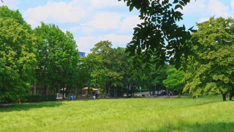 pan of vivid green park in southern german town of stuttgart