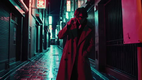 stylish person walking in neon-lit alley at night