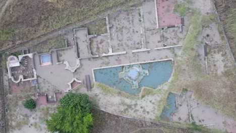 descending flight and overhead view and rotations of an archaeological complex, specifically a roman villa in talavera la nueva, we appreciate excavated areas and others restored for your visit.