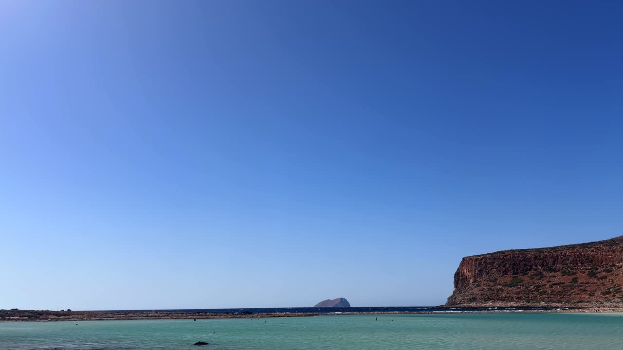 Balos Lagoon and sea view in Crete Greece with turquoise waters, cliffs, and a clear sky