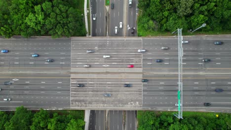 Satisfying-drone-overhead-of-highway-traffic-crossing,-4K