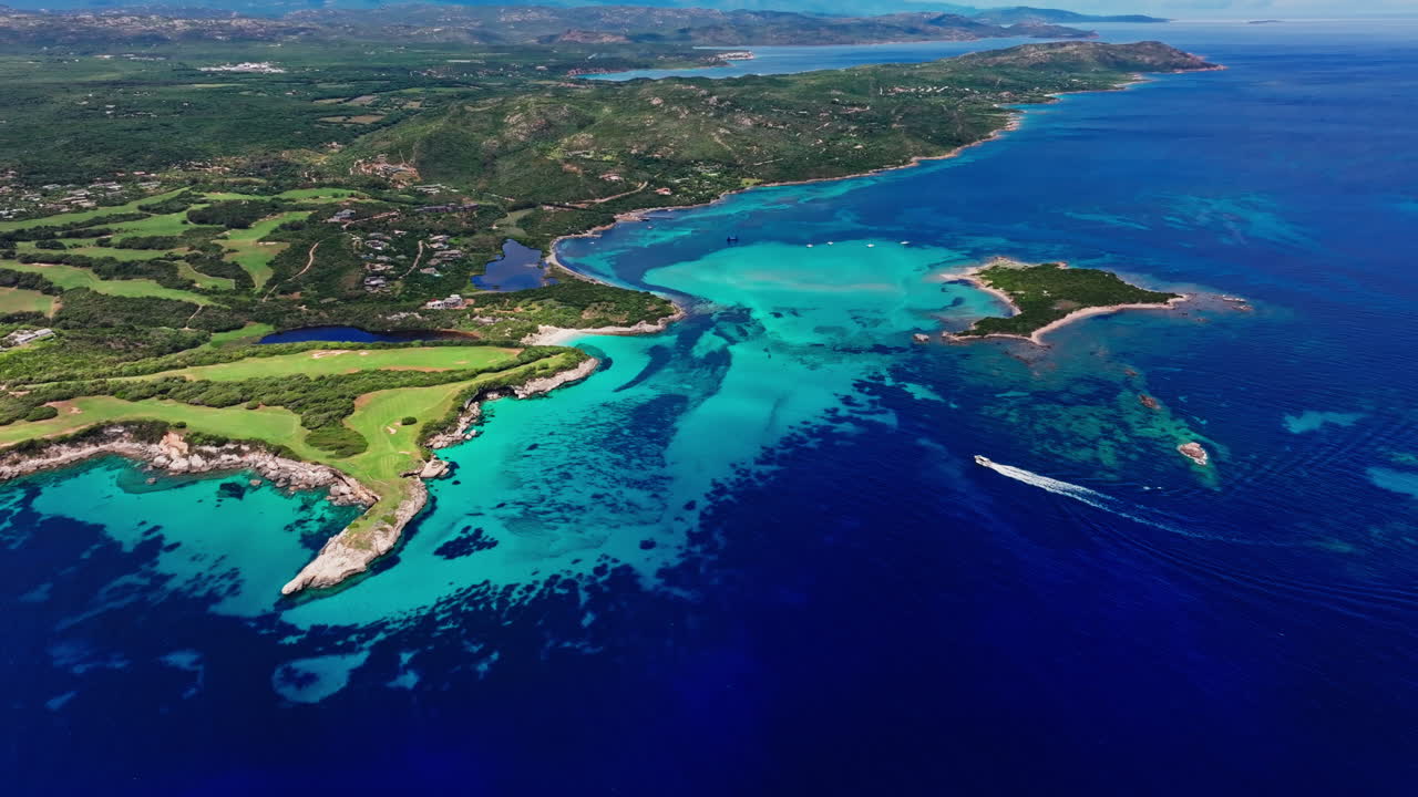 Aerial drone view of beautiful coastline of Corsica, France. High view of the colorful turquoise sea and the picturesque green landscape. Bird's eye view of the beaches. Summer holidays destination