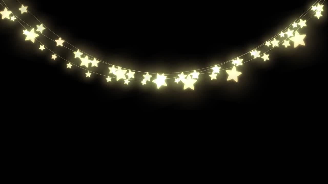 Glowing string of fairy lights with fireworks